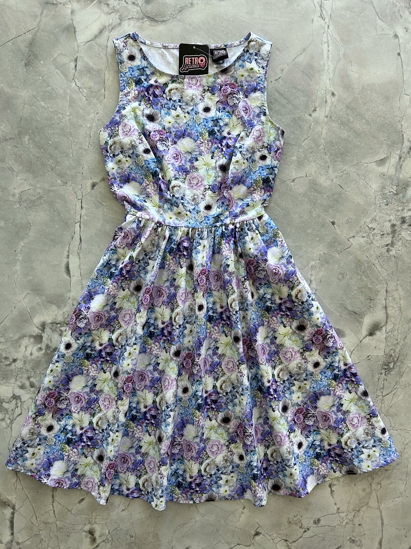 a flat lay of the blossom vintage dress