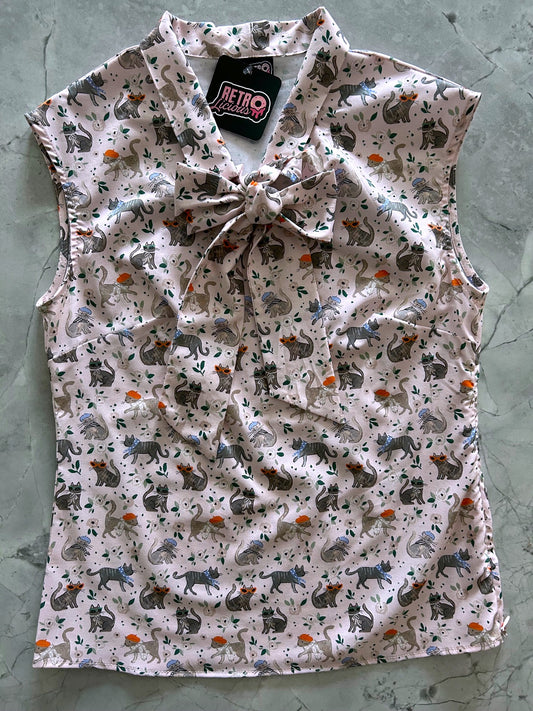 flat lay of parisian chic bow top 
