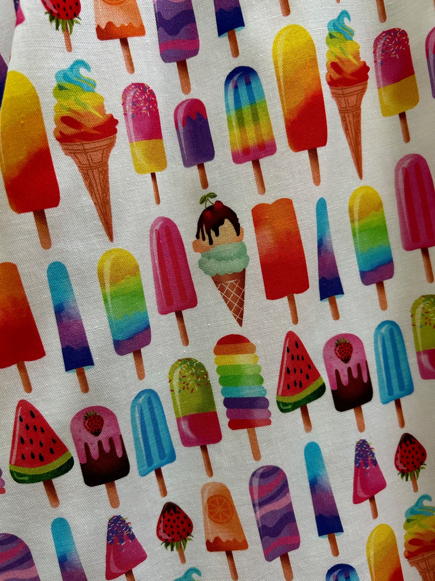 a close up showing the colorful ice cream print on white background