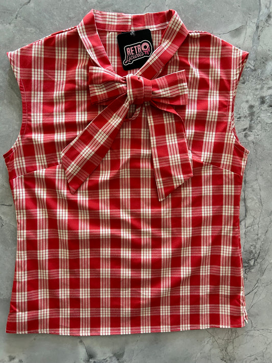 flatlay of the red plaid bow top