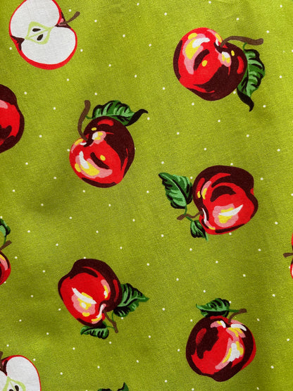 close up of the apples on green background