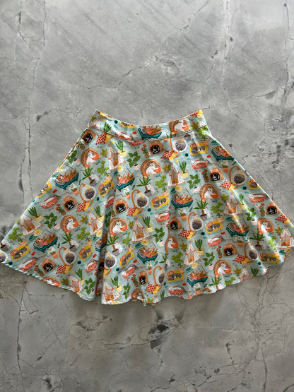 flat lay of cats and plants skater skirt