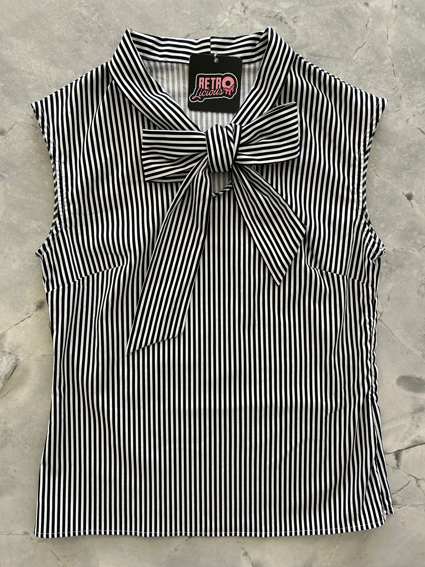 flat lay of black and white striped bow top