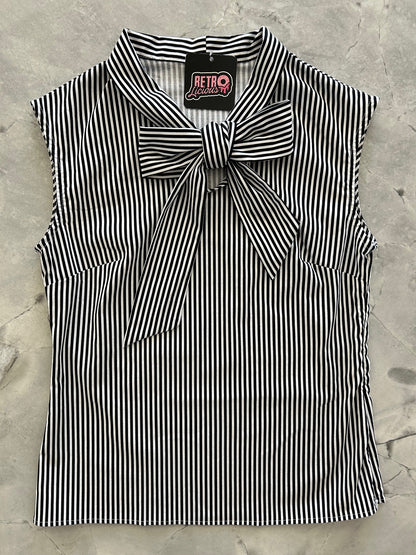 flat lay of black and white striped bow top