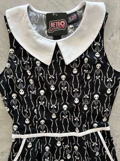 close up of the bodice of skeleton collared dress showing collar and piping detail