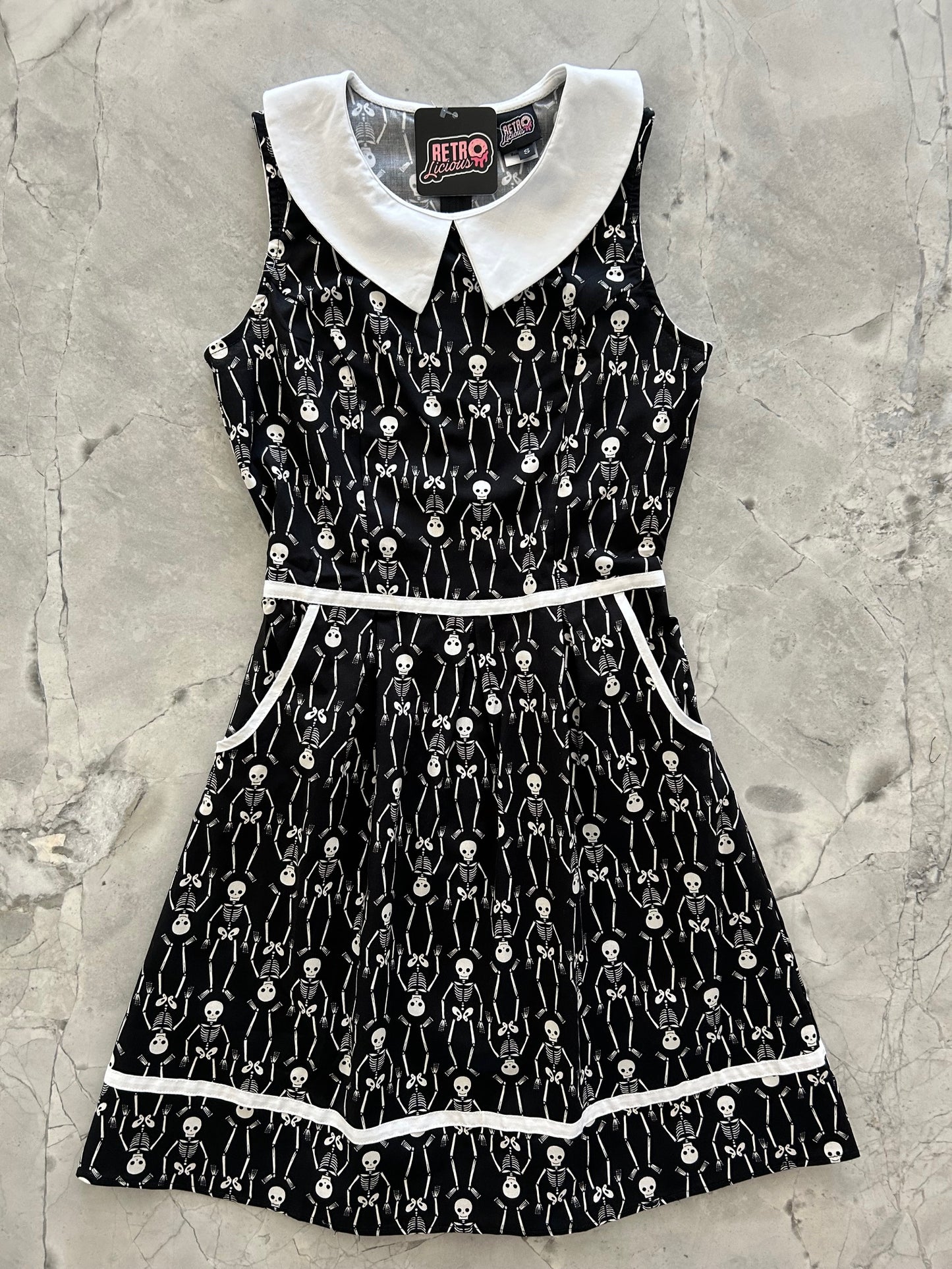 flatlay of skeleton collared dress