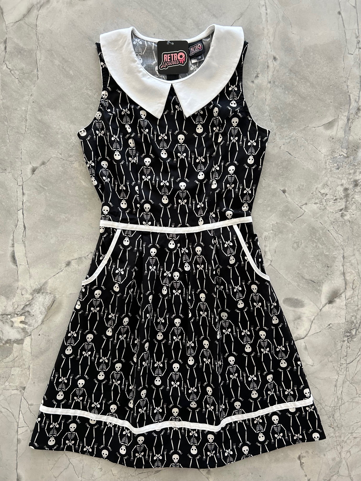 flatlay of skeleton collared dress