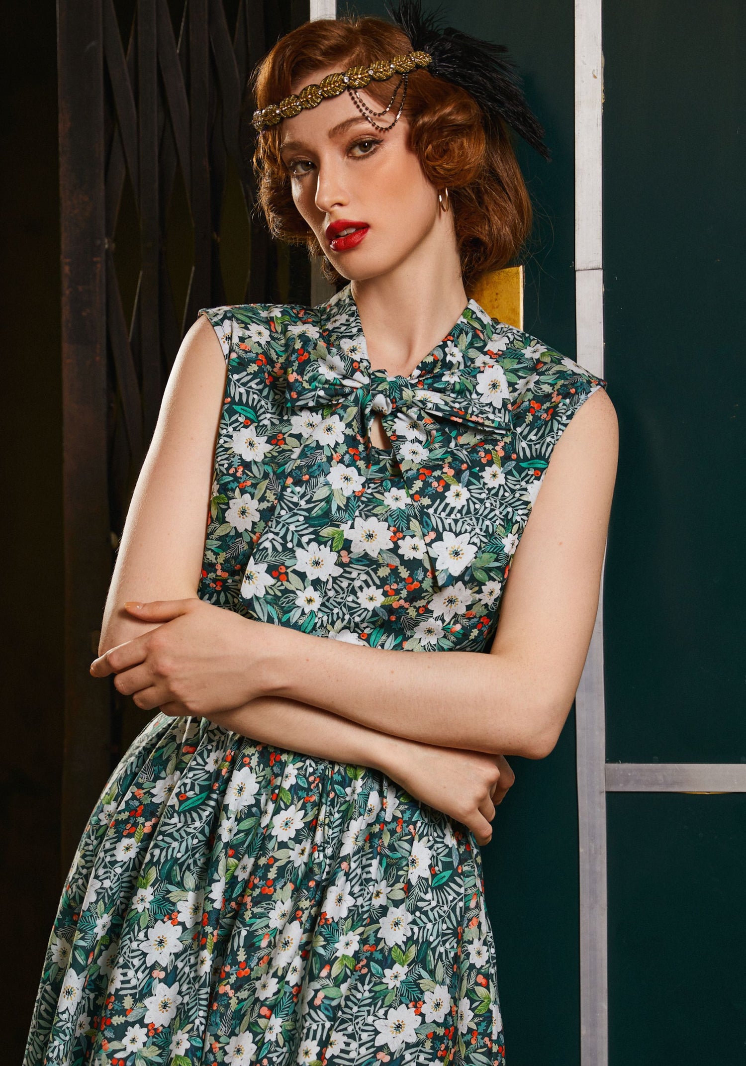 Woman wearing a floral dress with a dark background