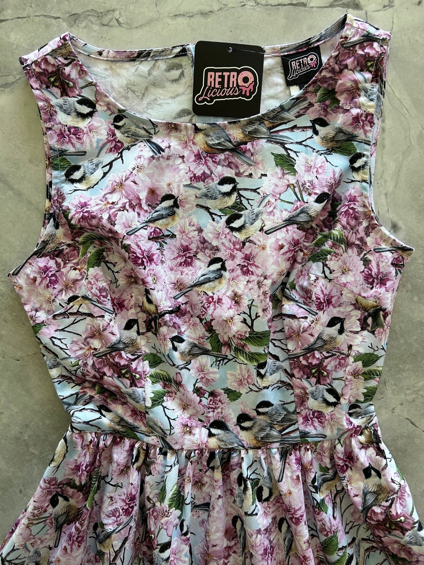 close up of bodice of birds midi dress