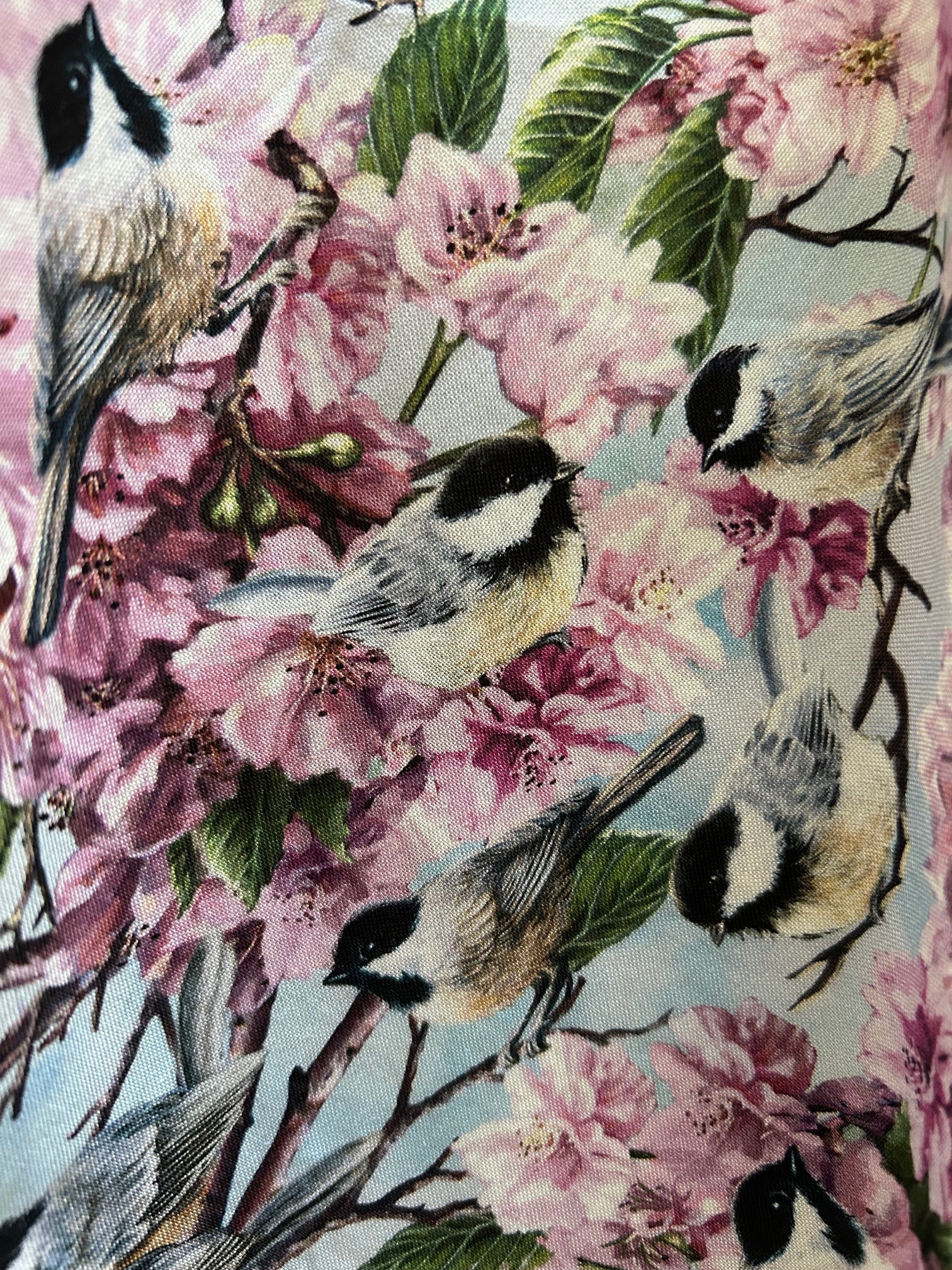 fabric close up showing the birds and the flowers