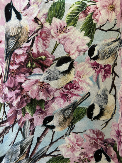 fabric close up showing the birds and the flowers