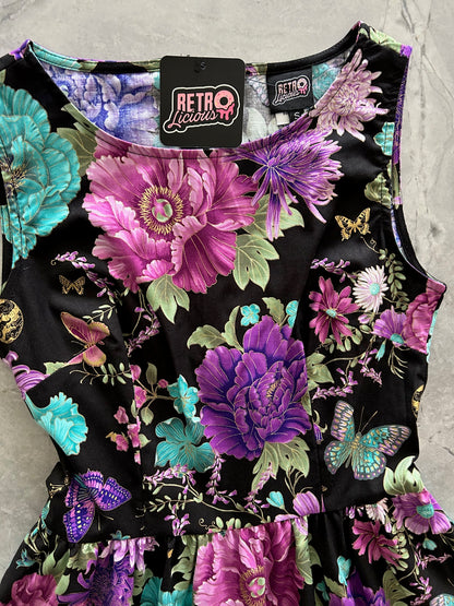 close up of bodice flatlay of butterfly floral vintage dress