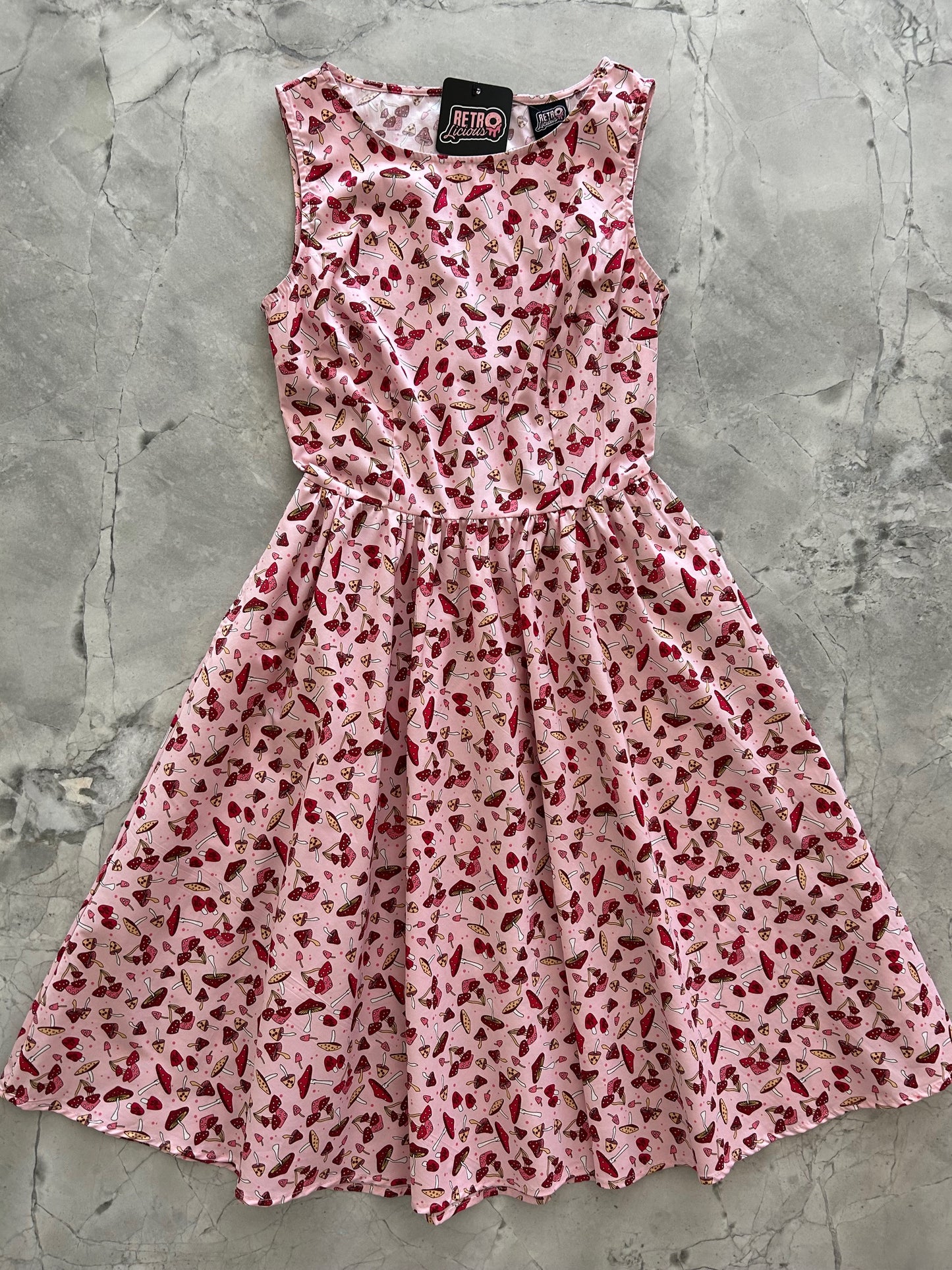 flatlay of toadstool vintage dress