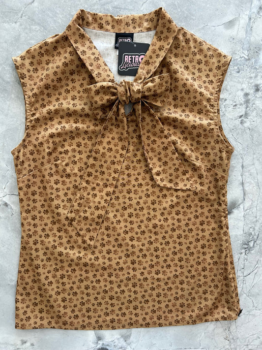 flatlay of paw print bow top