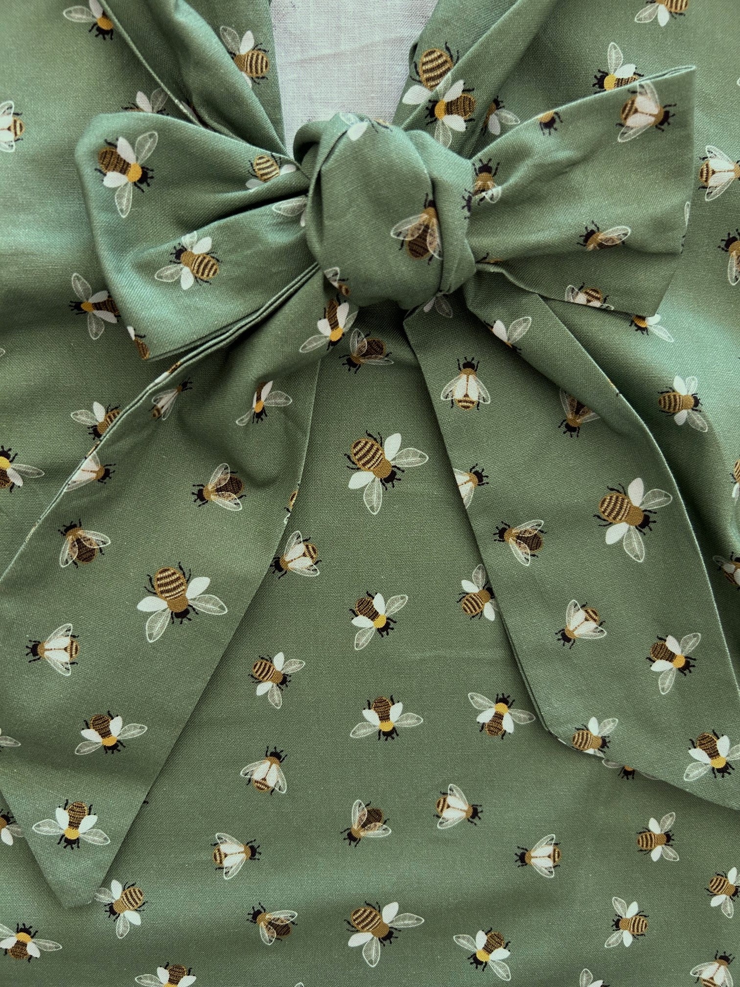 close up of bee bow top