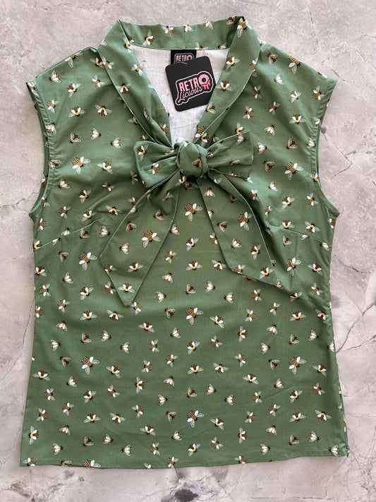 flatlay of bee bow top