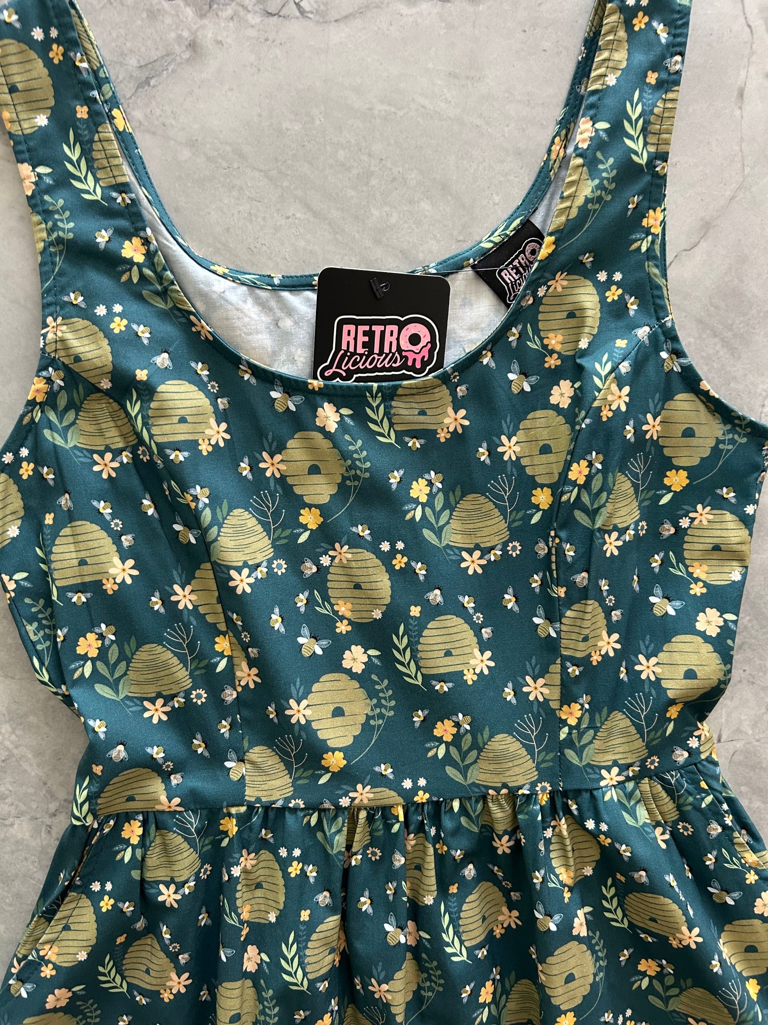 close up of flatlay of beehive dress