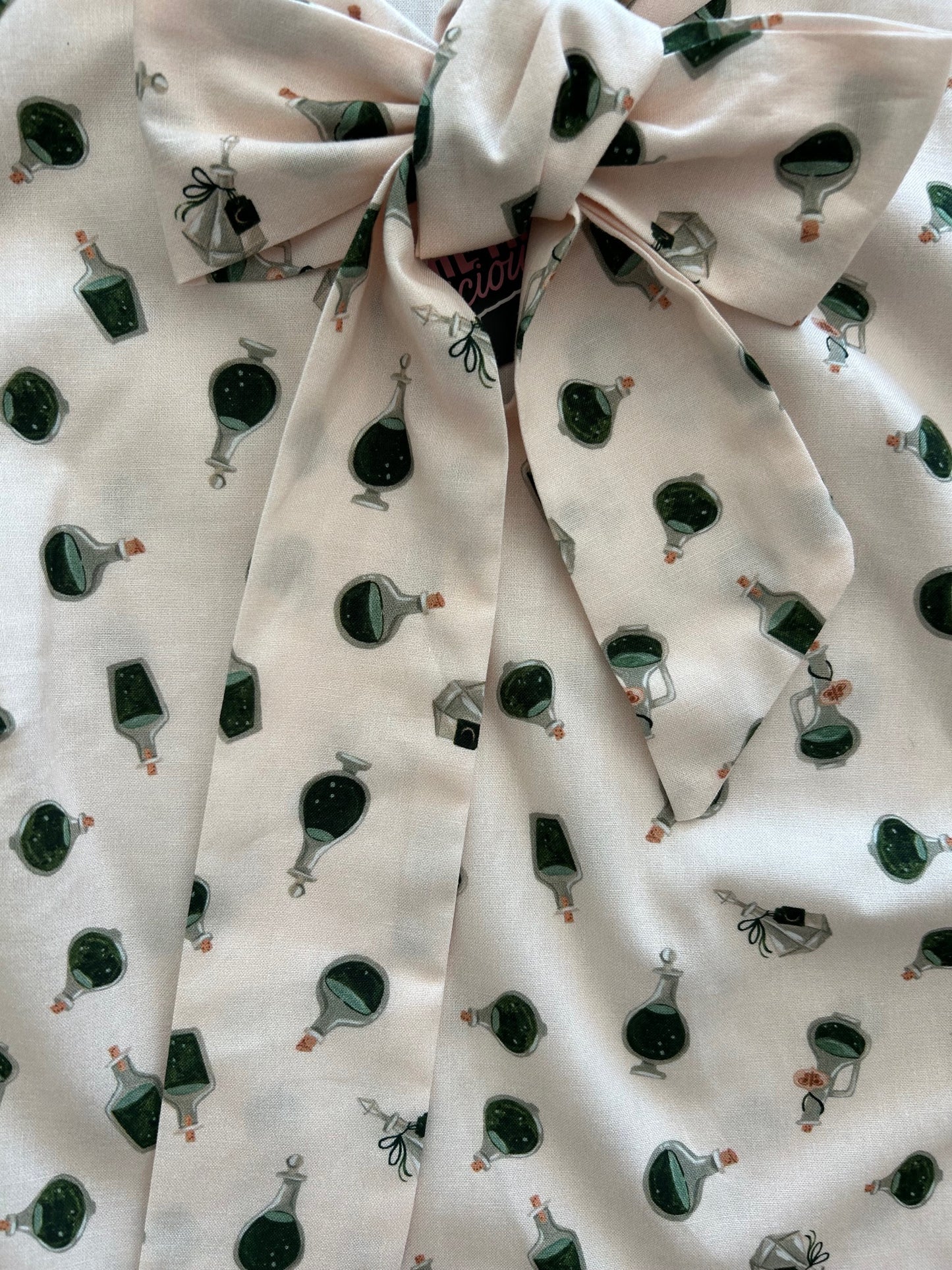 close up of flatlay of potions bow top