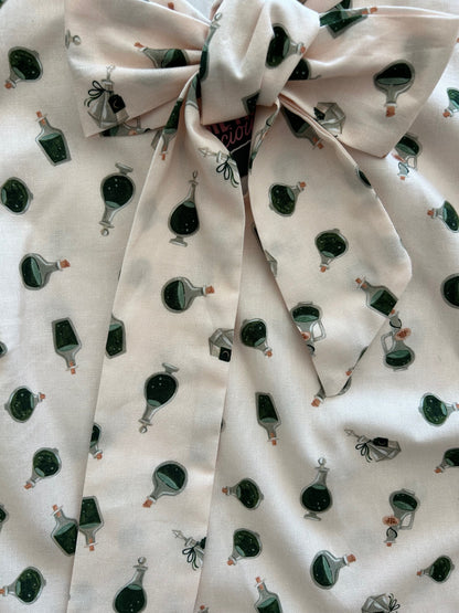 close up of flatlay of potions bow top