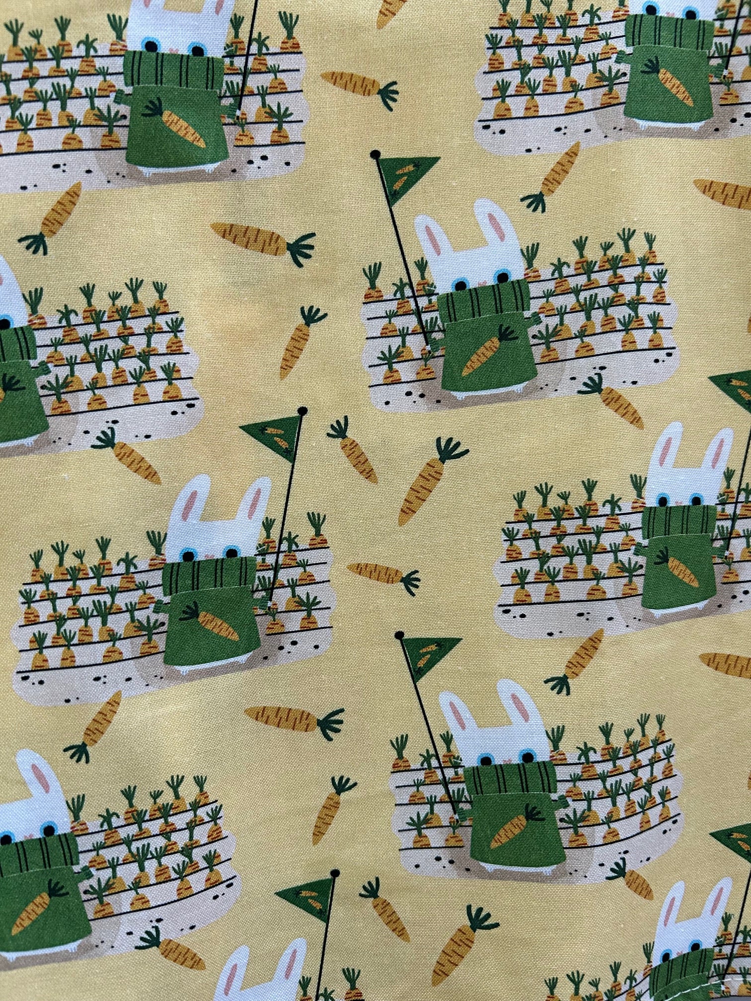 close up of gardeny bunny print showing the bunnies on yellow background