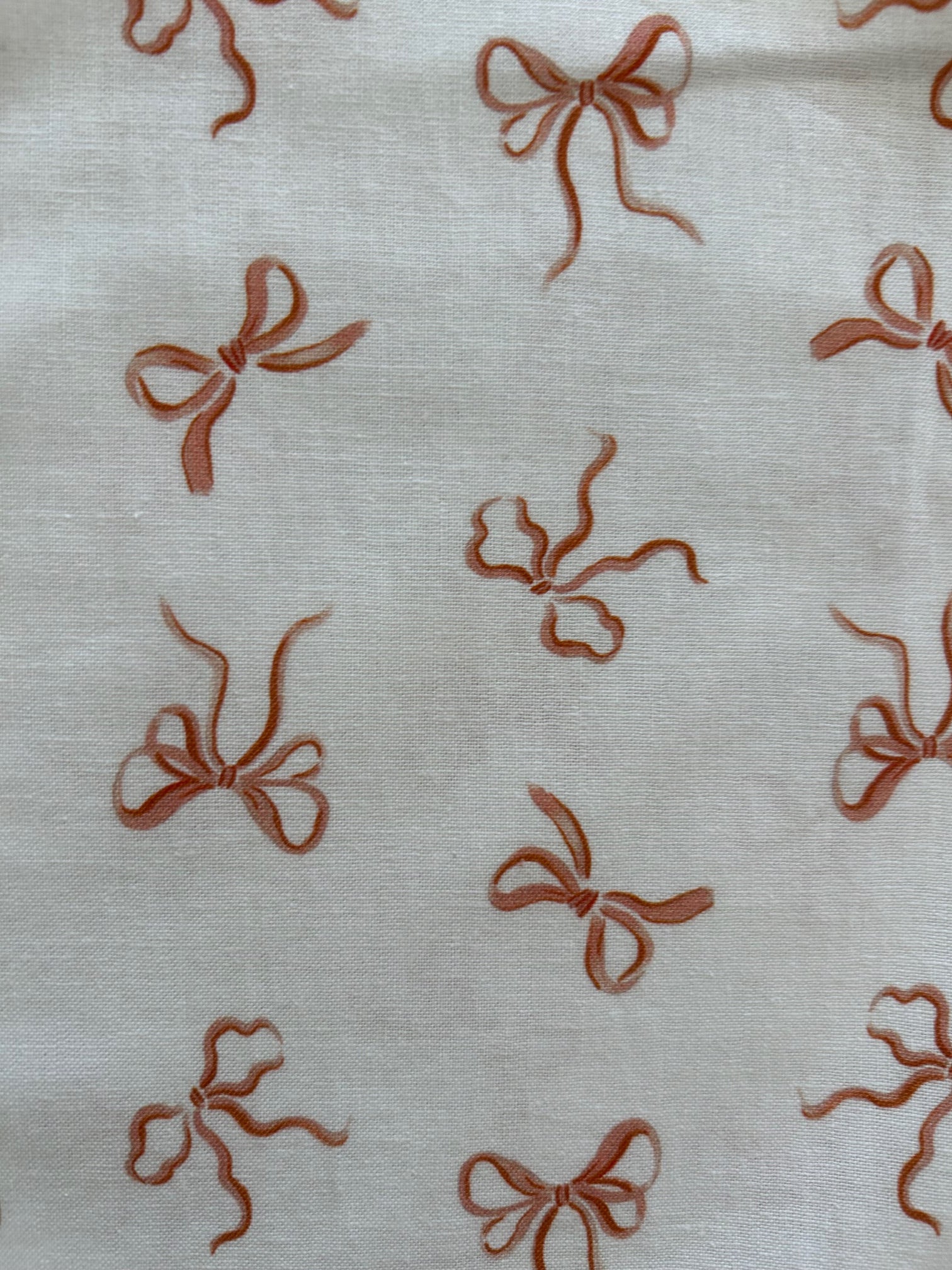 close up showing pink bows on white background