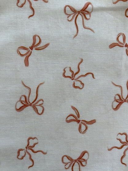 close up showing pink bows on white background