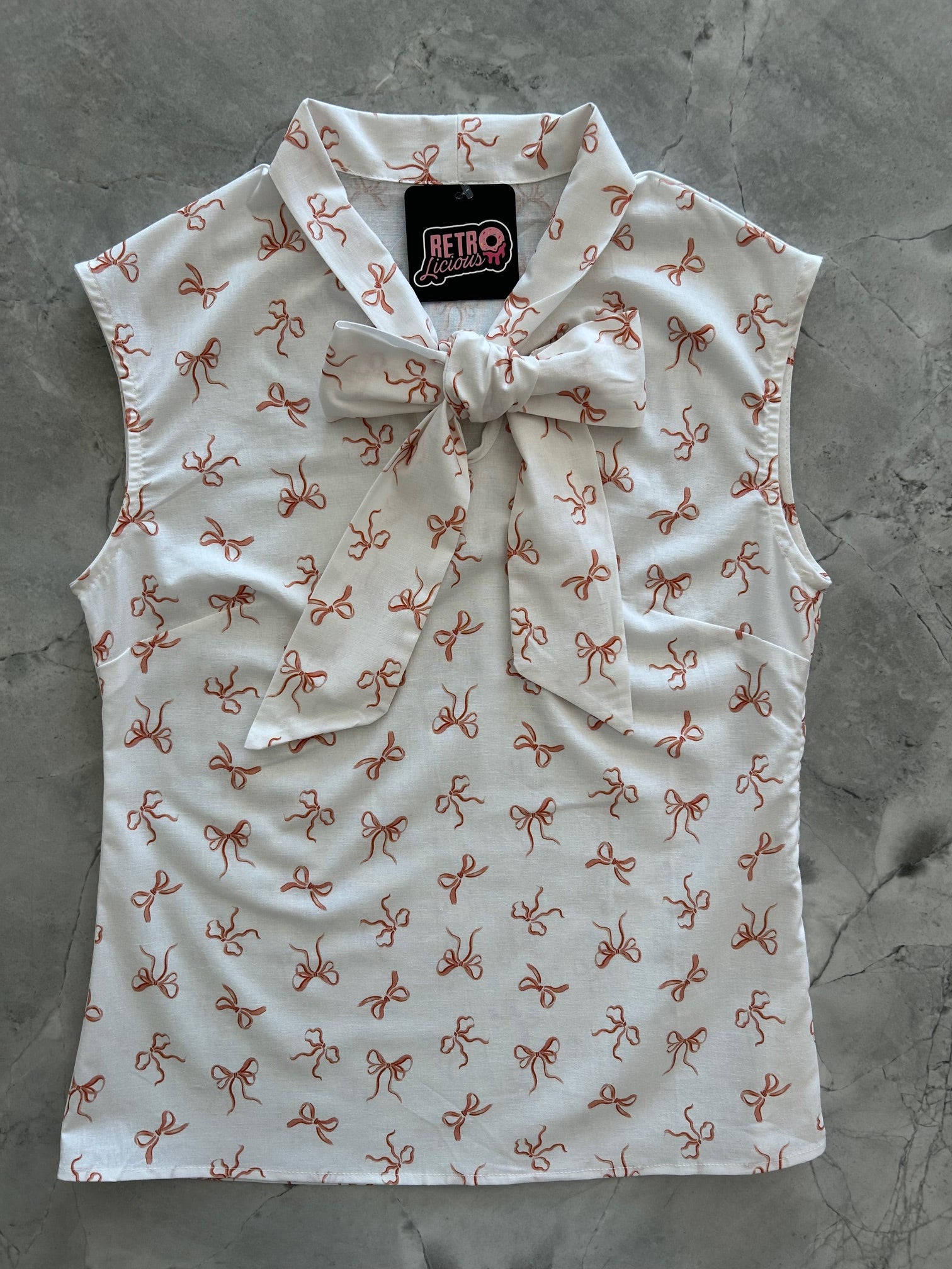 flatlay of pink bows bow top