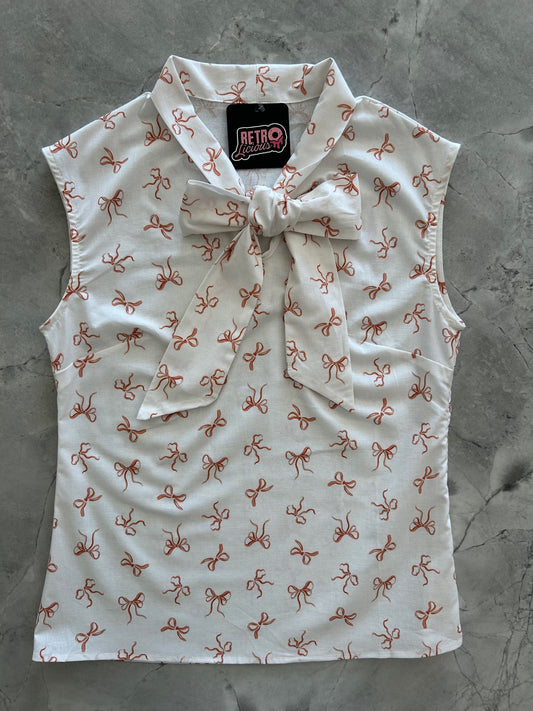 flatlay of pink bows bow top