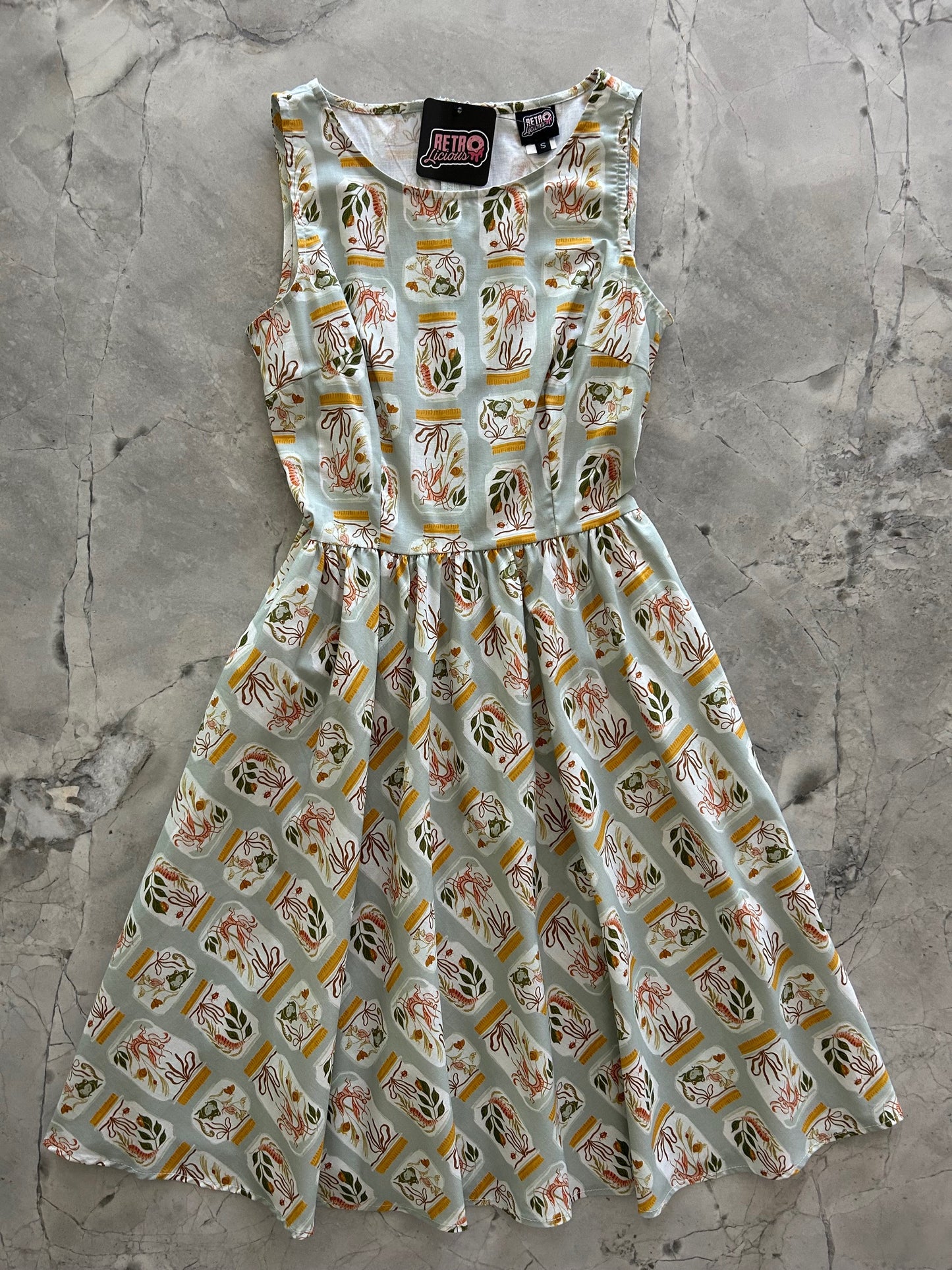 flatlay of jars vintage dress