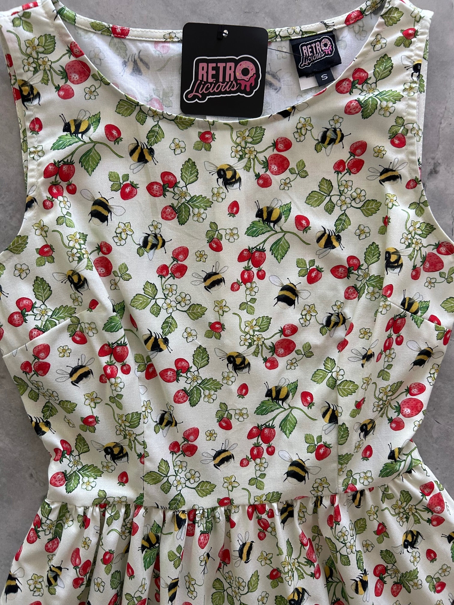 flatlay of the bodice of our berry bees vintage dress