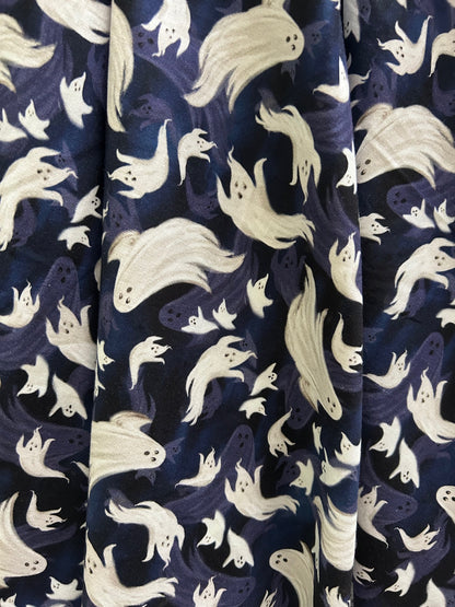 close up of flying ghosts print on navy background