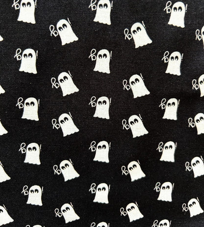 close up of mini ghosts print on black background and white ghosts