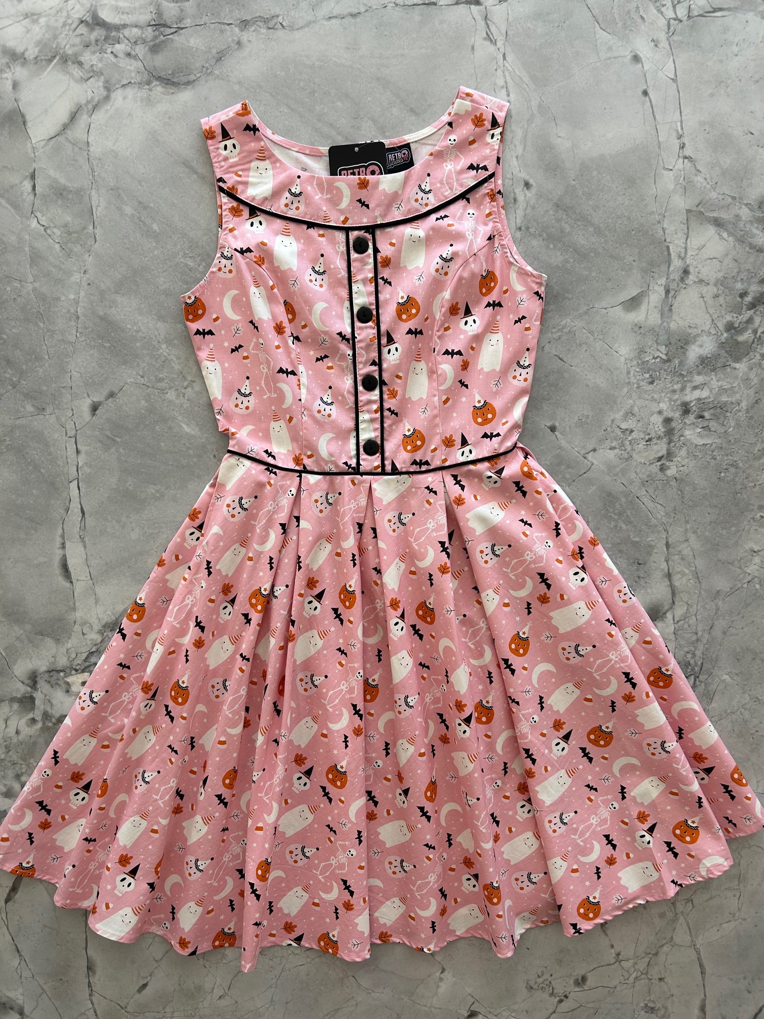 flatlay of elizabeth dress in pink halloween