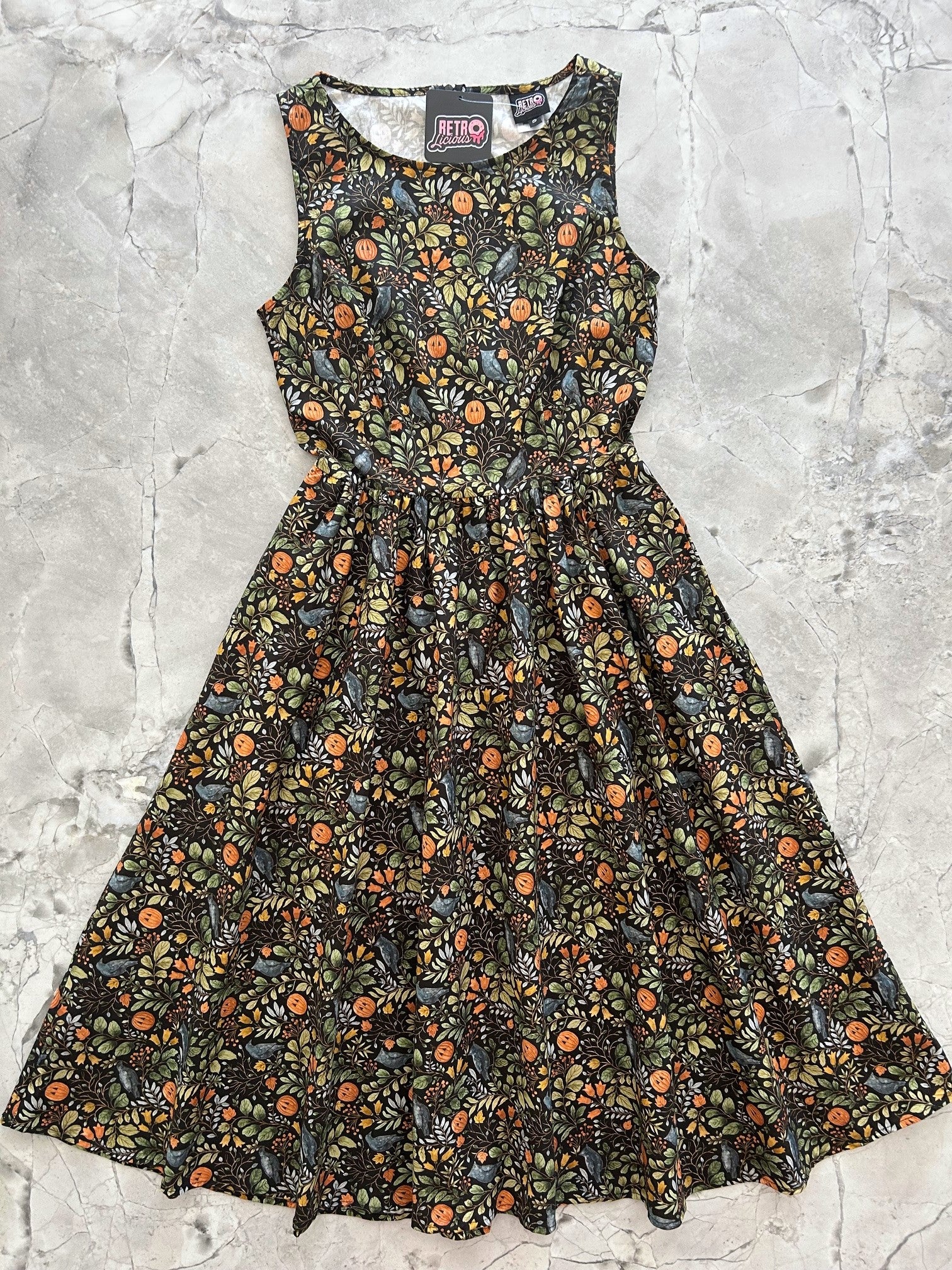 flatlay of Pumpkin Foliage Midi Dress