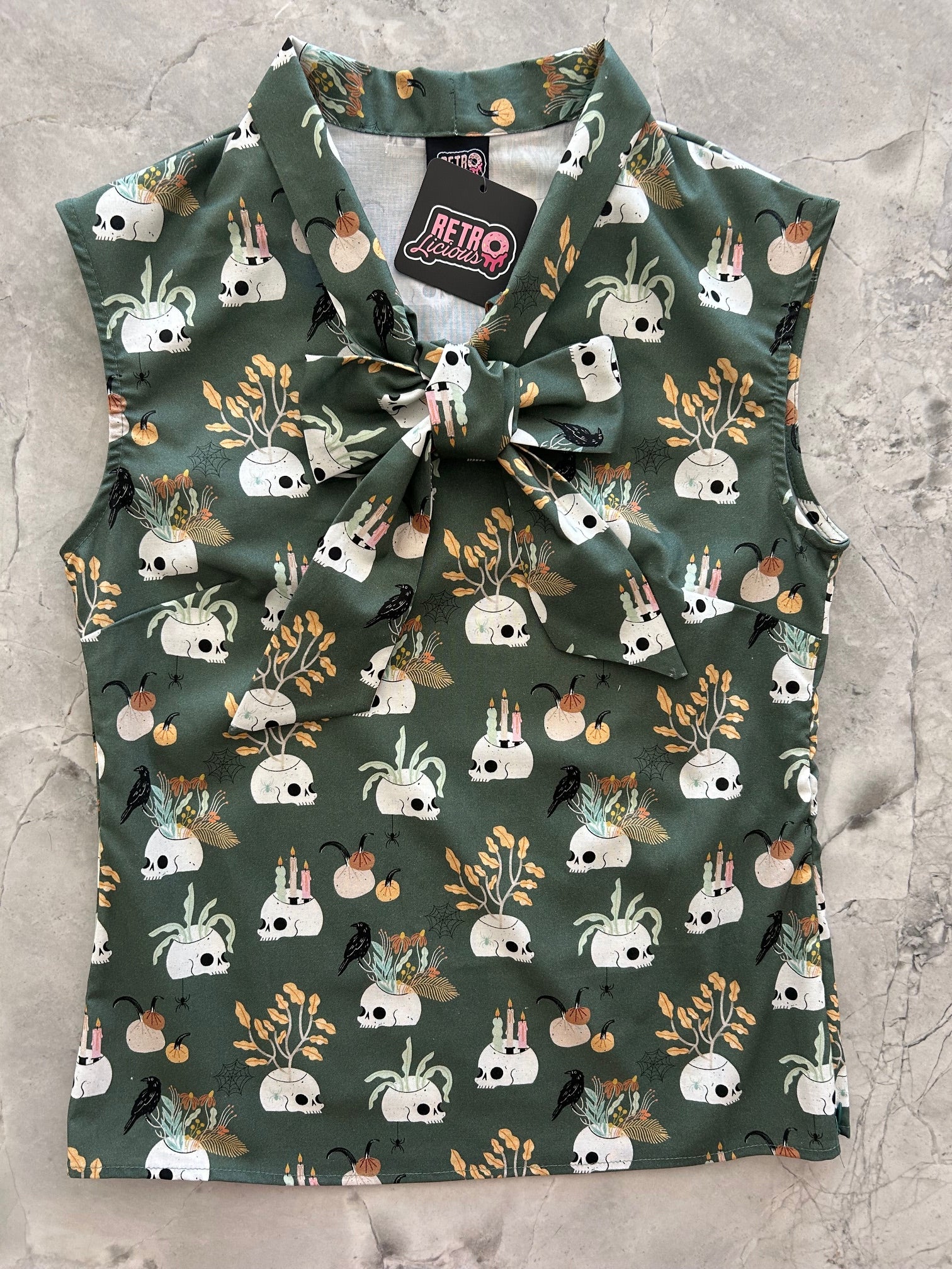 flatlay of Skulls & Candles Bow Top