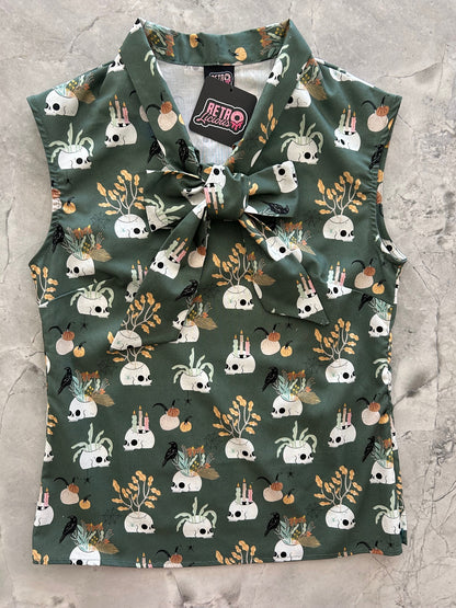 flatlay of Skulls & Candles Bow Top