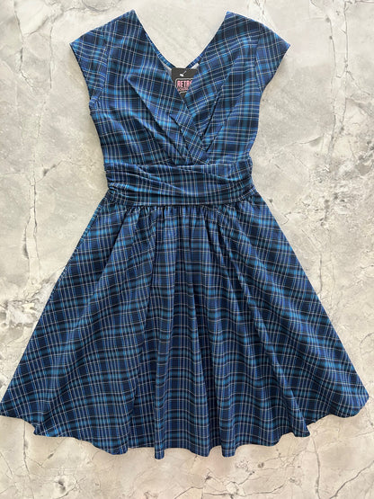 flatlay of our blue plaid greta dress