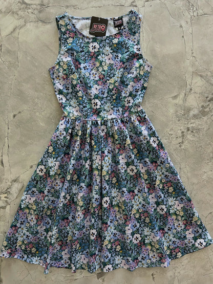 flatlay of painted floral vintage dress