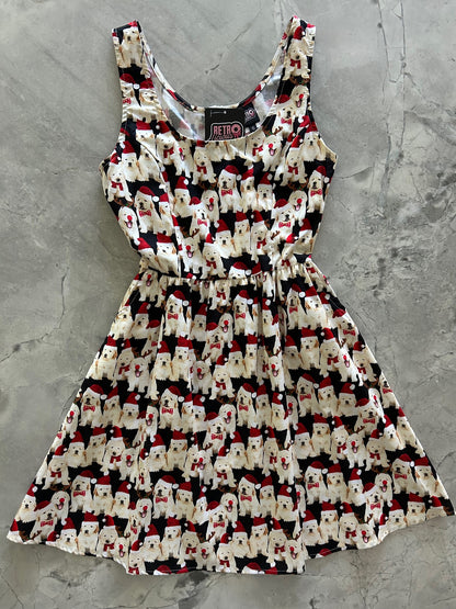 flatlay of dogs in santa hats on black background