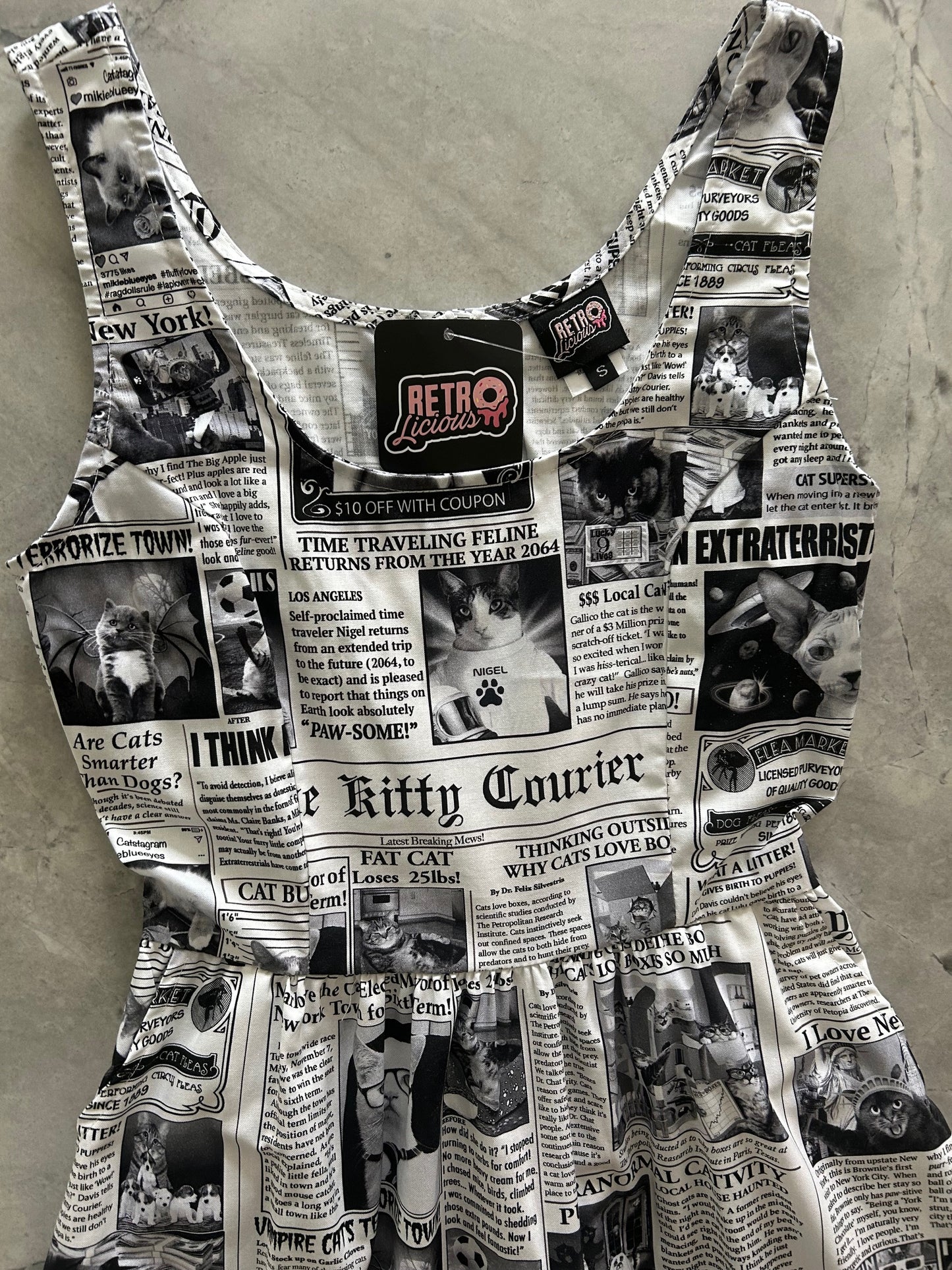 flatlay of bodice of newspaper cats fit and flare dress