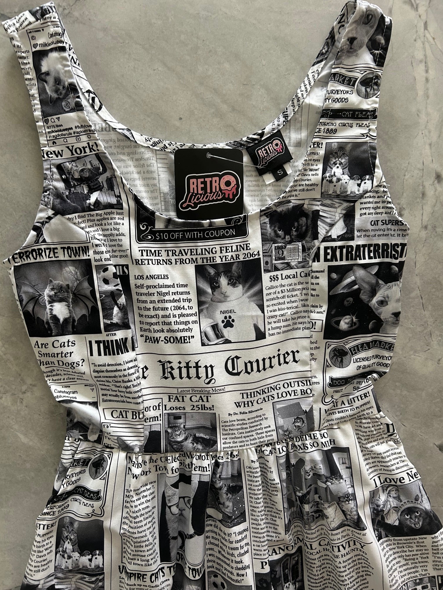 flatlay of bodice of newspaper cats fit and flare dress