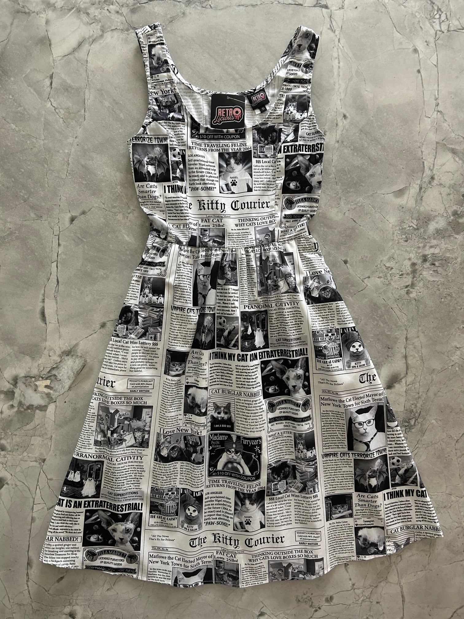 flatlay of newspaper cats fit and flare dress
