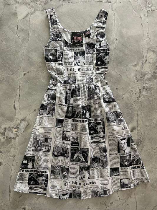 flatlay of newspaper cats fit and flare dress