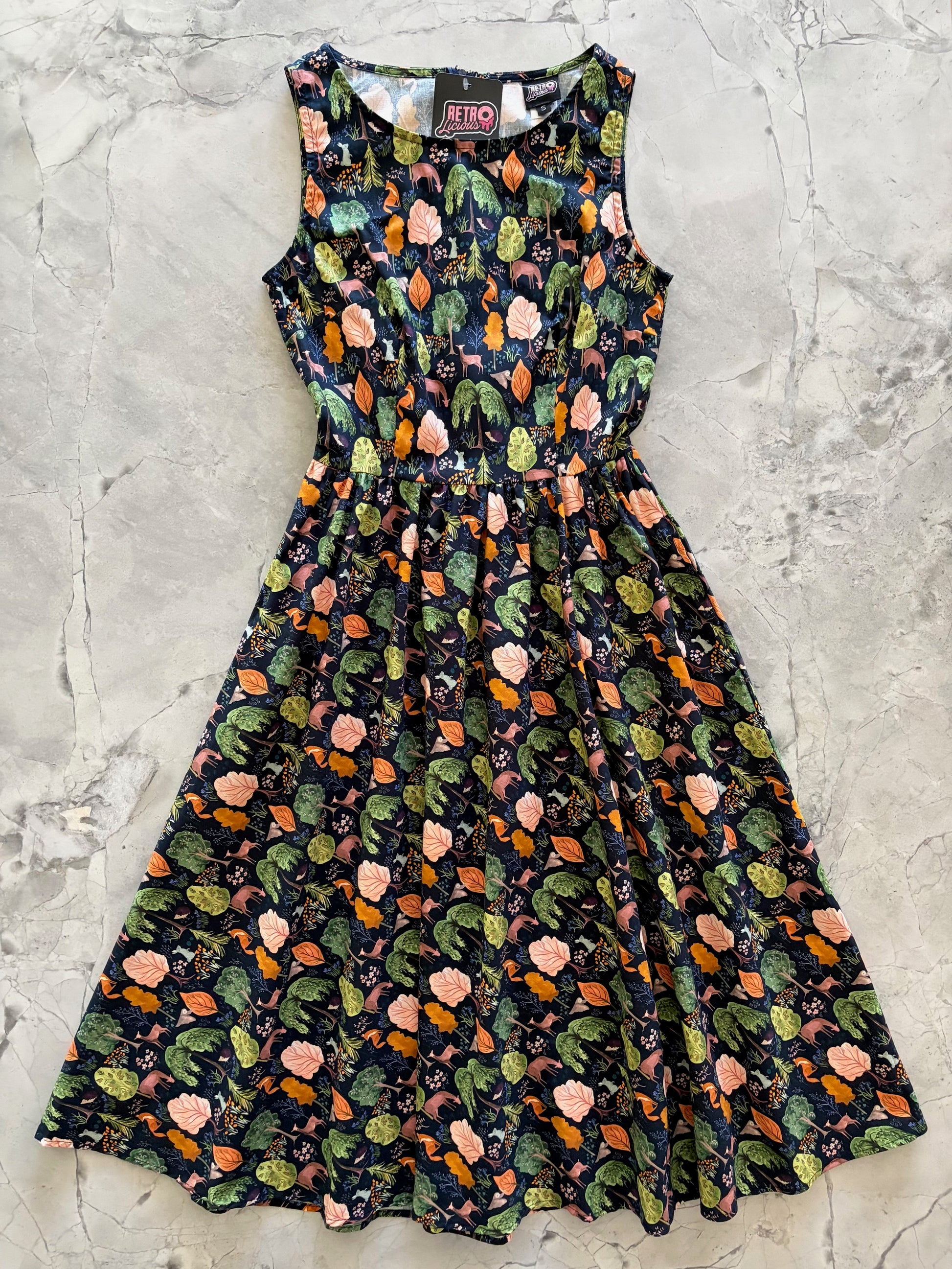 Floral patterned dress on a textured gray surface