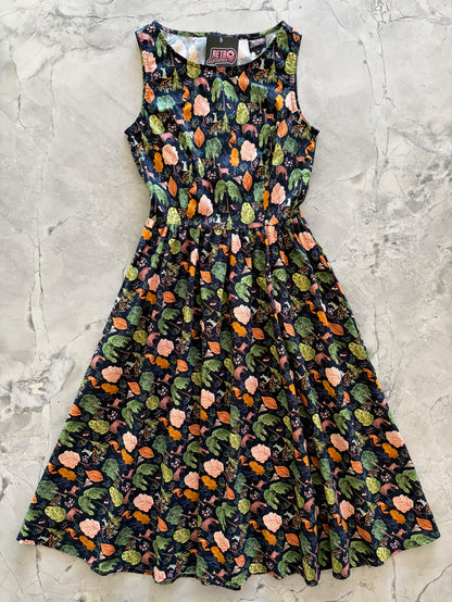 Floral patterned dress on a textured gray surface