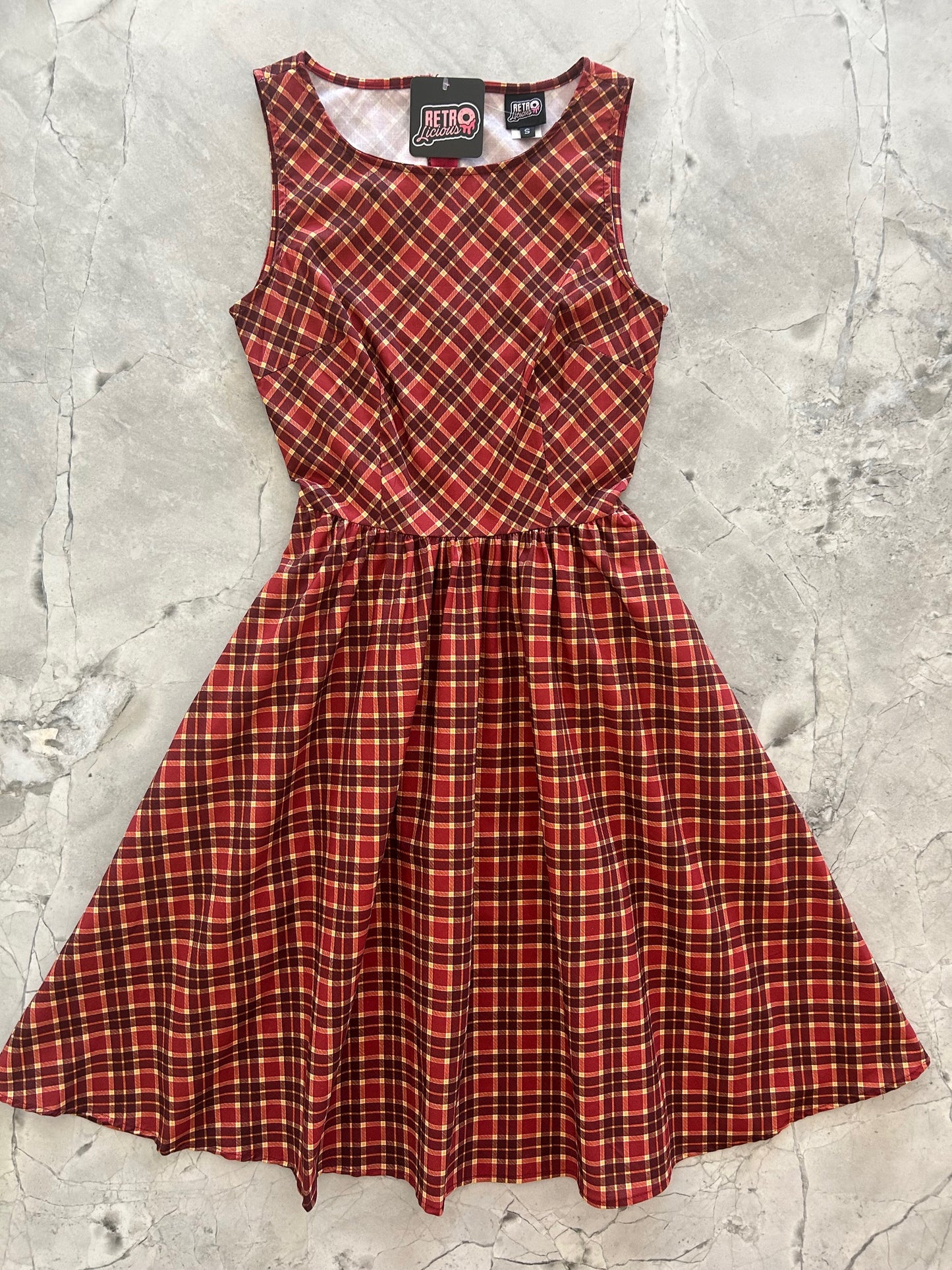 flatlay of plaid vintage dress