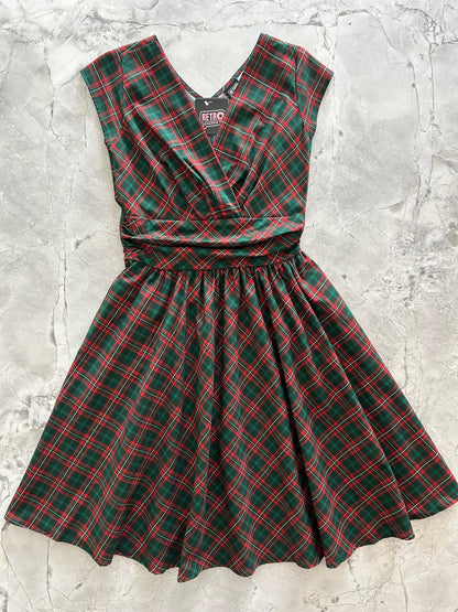flatlay of holiday plaid greta dress