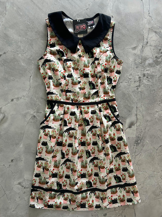 flatlay of cats and plants collared dress