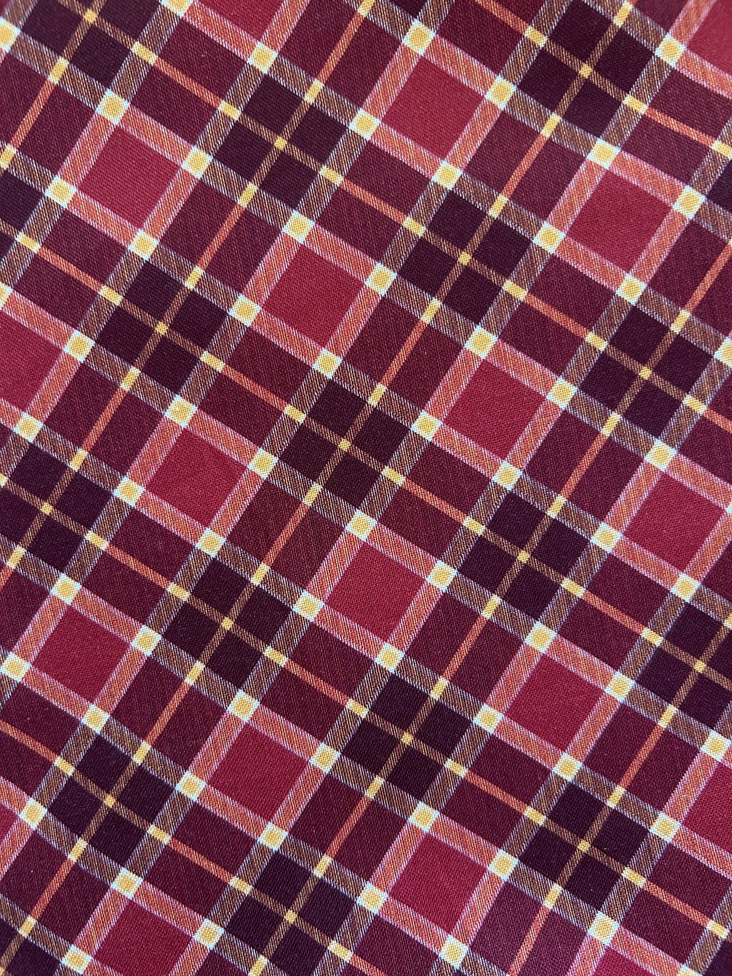close up of the burgundy and gold plaid