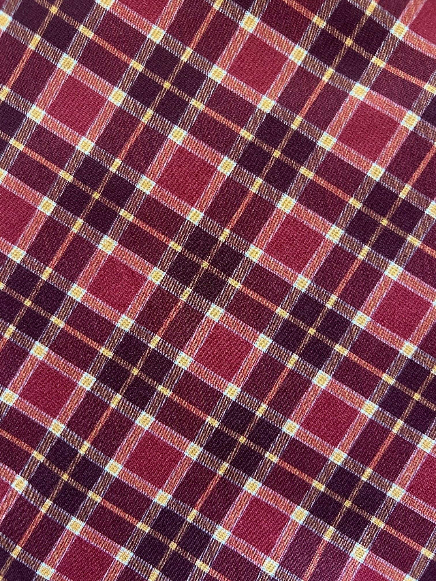 close up of the burgundy and gold plaid